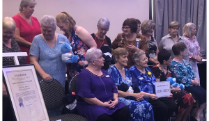 Quota Beenleigh members sit by their Charter